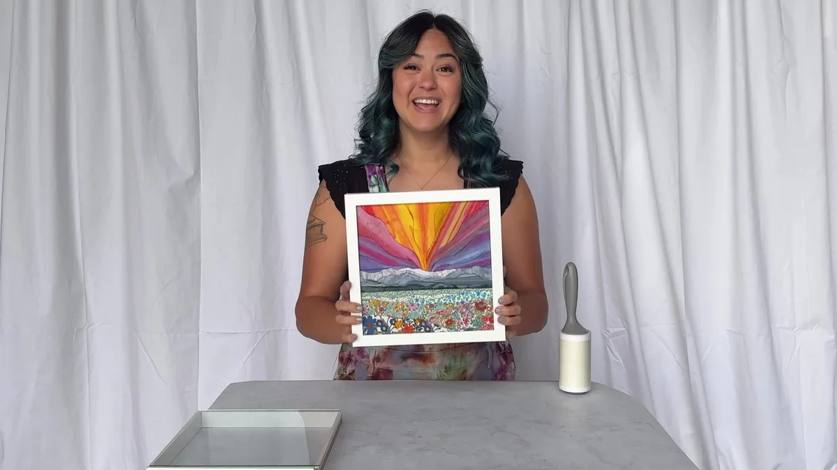 Bonus 1: Hannah holding her finished kinusaiga piece in its shadow box frame
